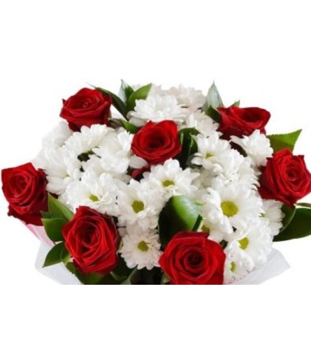 Red Roses and White Accent Flowers. An arrangement by Flowers by Priscilla.