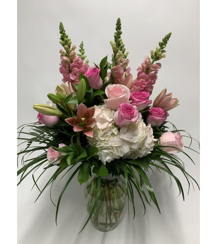Blow her away. An arrangement by DMP Flowers and Gifts.