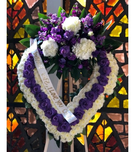 Purple Heart to Heart. An arrangement by Geni's Florist and Gifts.