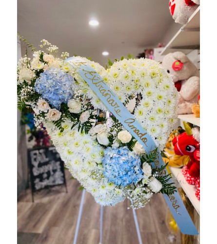 BLUE DOUBLE BOW HEART - Deluxe. An arrangement by Geni's Florist and Gifts.