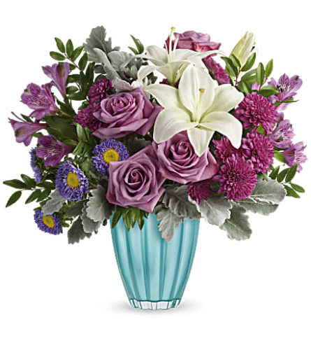 Teleflora's Spring in Your Step - Deluxe. An arrangement by Sueppel's Flowers.