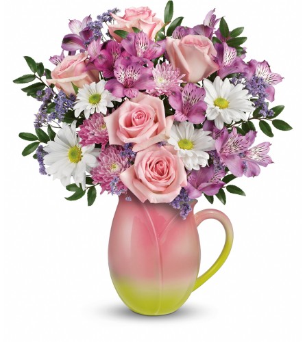 Teleflora's Spring Pitcher - Deluxe. An arrangement by Sueppel's Flowers.