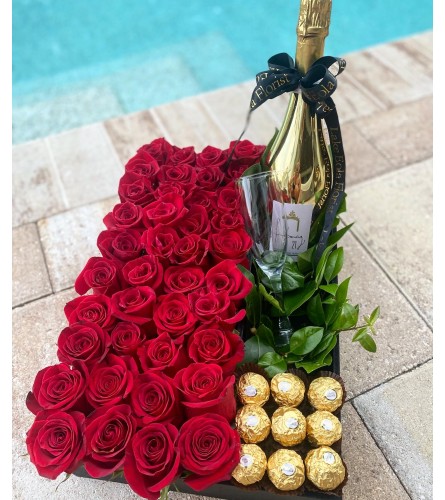 Roses and Wine. An arrangement by Lake Eola Florist.