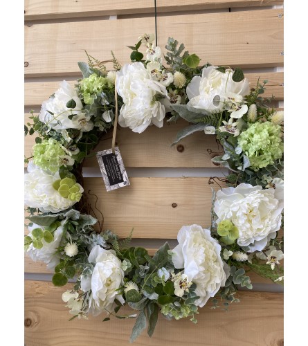 White peony door wreath. An arrangement by Flower Trends Florists.
