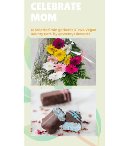 Wrapped Mini Gerberas and Vegan Bounty Bars. An arrangement by Floratechnics.
