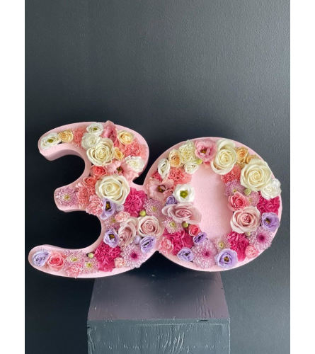 Double numbers (10,20,30,40,50,60,70,80). An arrangement by Lux Flower Box.