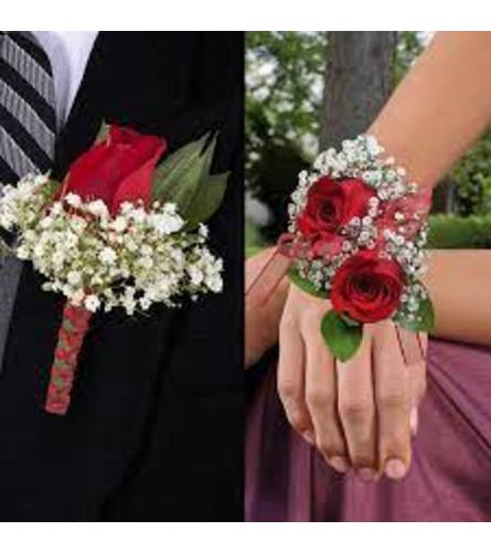 Red Roses Corsage + Boutonniere. An arrangement by Flower World and Gifts.