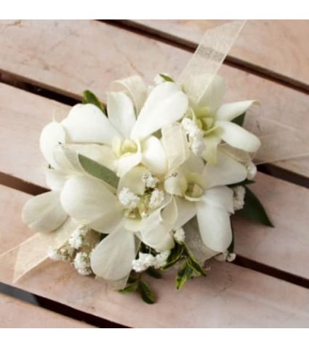 White Dendrobium Orchid Corsage. An arrangement by Flower World and Gifts.