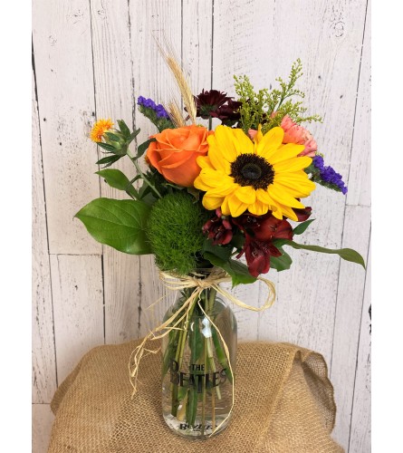 Yellow Submarine Fall arrangement. An arrangement by Incredible Florist Seton.