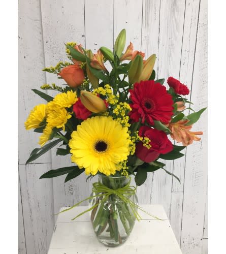 Vibrant Autumn Arrangement. An arrangement by Avenida Flowers.