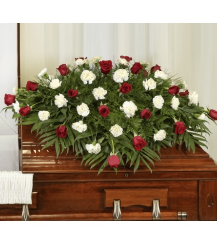 Kelly Ann’s red and white casket spray