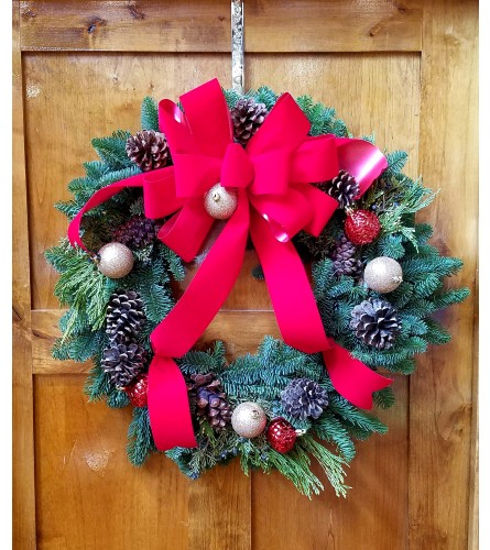 Jenny's Floral Christmas Wreath. An arrangement by Petals and Pages.