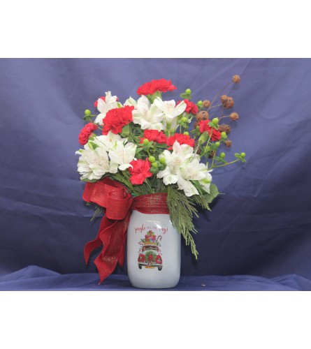 Jingle all the Way Mason Jar. An arrangement by Stephenville Floral.