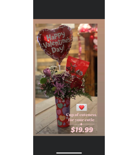 Cup Of Cuteness. An arrangement by Kelly Ann's Floral.