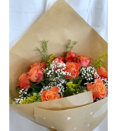 Orange Rose Wrapped (12/12 deluxe/24) - Deluxe. An arrangement by Floratechnics.