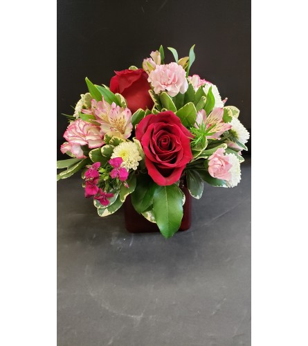 Valentine's Day Mixed Variety in Red Glass Cube. An arrangement by Thurston Flowers.