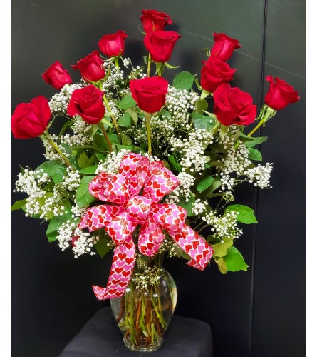 12 Dozen Long Stem Red Roses. An arrangement by Marivel's Florist and Gifts.