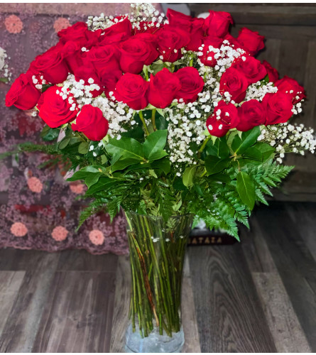 Red Rose Extravaganza. An arrangement by Flower World and Gifts.