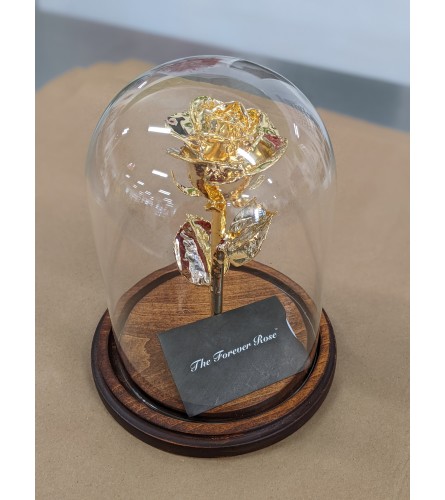 24 Karat Gold Dipped Forever Rose with Maple Base and Glass Dome. An arrangement by Flowers of Jacksonville.