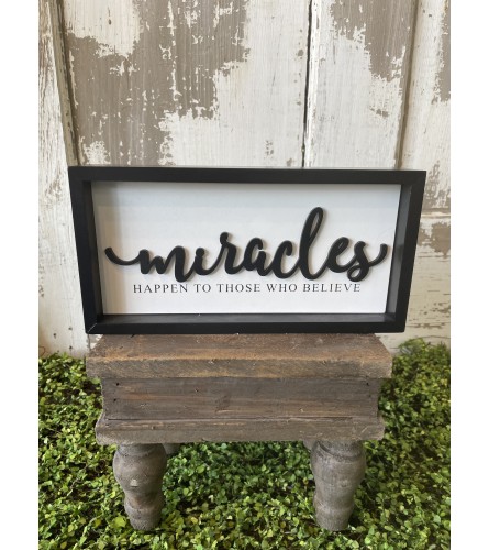Miracles Happen Sign. An arrangement by Metcalfe Florist and Pleasant View Greenhouses.