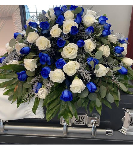 The blue and white casket spray