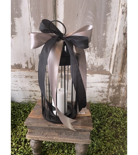 Round Lantern with Candle. An arrangement by Metcalfe Florist and Pleasant View Greenhouses.