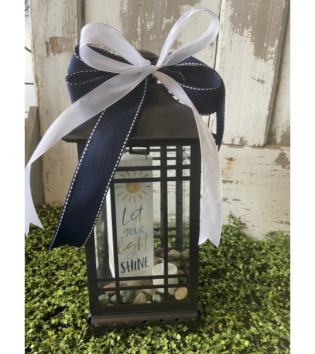 Let Your Light Shine Lantern. An arrangement by Metcalfe Florist and Pleasant View Greenhouses.