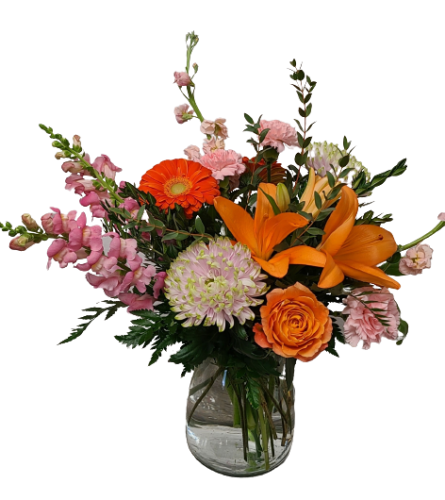 Tequilla Sunrise. An arrangement by Harriet's Flower and Gift Shop.