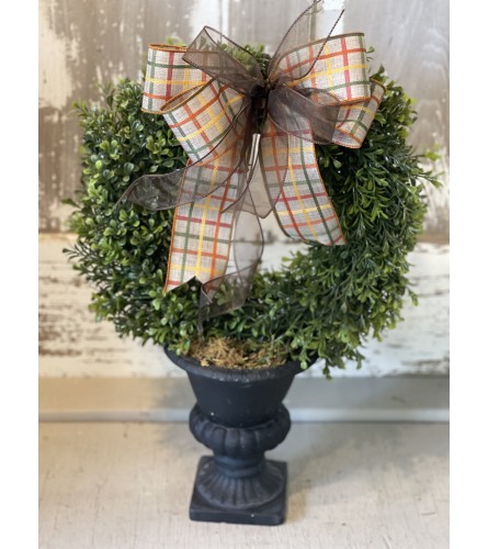 Boxwood Wreath in Urn with Fall Bow