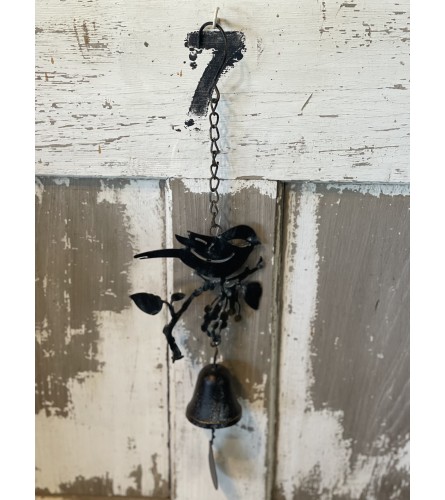 Metal Bird Wind chime. An arrangement by Metcalfe Florist and Pleasant View Greenhouses.