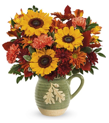Autumn Acorn Pitcher by Teleflora - Deluxe. An arrangement by Sueppel's Flowers.