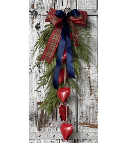 Swag with Blue Ribbon and Heart Bells. An arrangement by Metcalfe Florist and Pleasant View Greenhouses.
