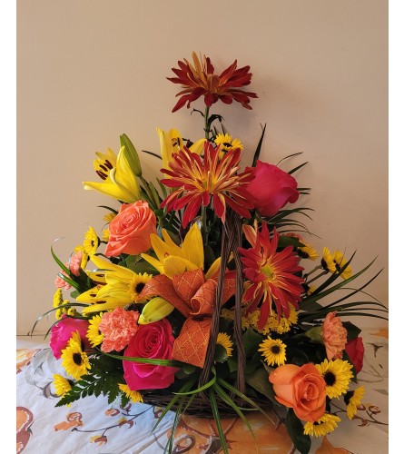 HAPPY THANKGIVING BASKET. An arrangement by A Loving Touch Florist.