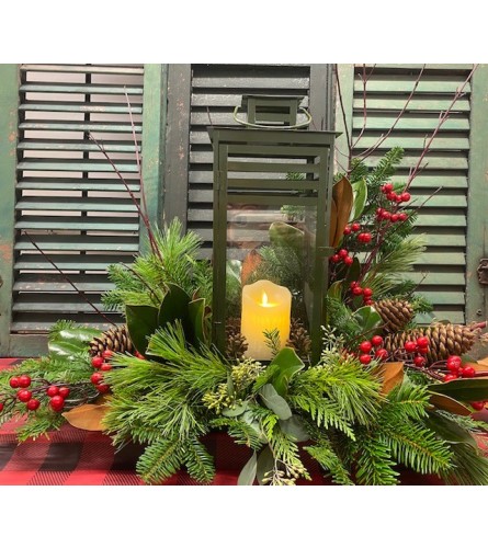 Premium Holiday Glow Lantern Arrangement. An arrangement by Forest Florist.