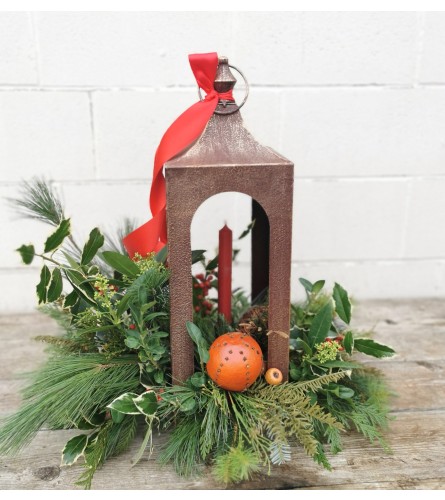 Yuletide Candlelight. An arrangement by The Garden Gate Gifts and Florals.
