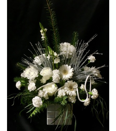 Winter Medley. An arrangement by Roma Flowers and Gifts.