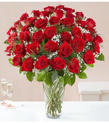 100 Long Stem Unique Red Roses. An arrangement by Aventura Blooming Petals.