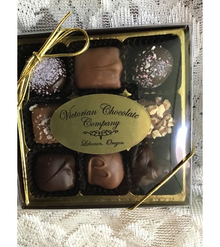 9 piece chocolate. An arrangement by Country Girl Flowers.