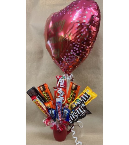Valentine Day Candy Mug Bouquet. An arrangement by Stayton Flowers.