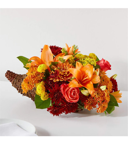 The FTD Bouquet of Blessings Cornucopia - Deluxe. An arrangement by Mae's Flowers and Gifts.