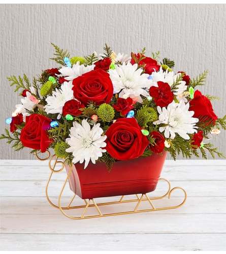 1-800 Christmas Sleigh. An arrangement by Flower Spot Florist.