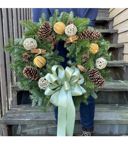 Aromatic Holiday Wreath. An arrangement by Violeta's Flower Shop.