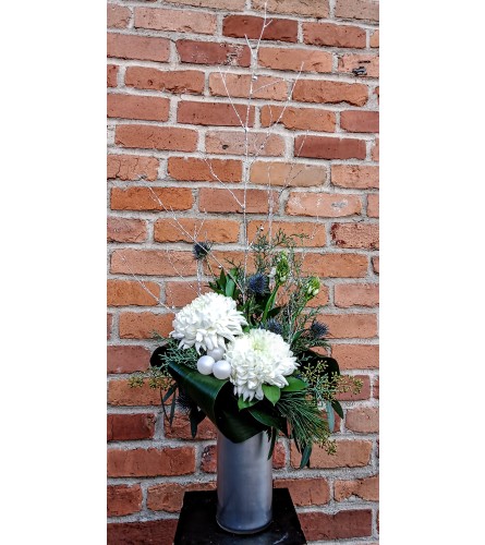 'By Design' Blue Christmas. An arrangement by Flowers By Design.