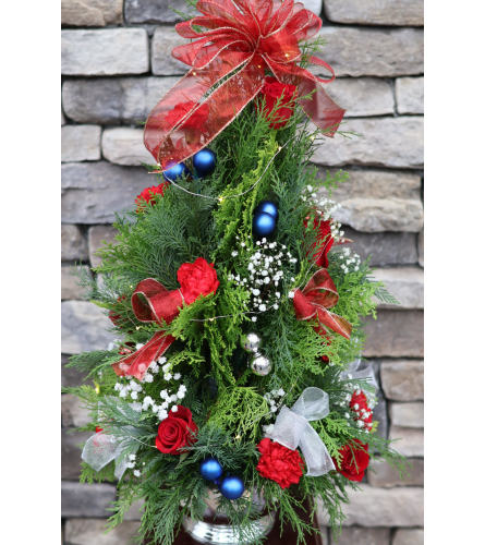 Christmas Tree With Lights - Deluxe. An arrangement by Sonia's Florist.