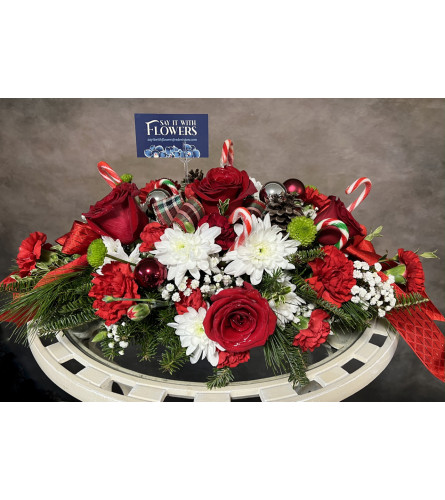 A Candy Cane Christmas. An arrangement by Say It With Flowers.
