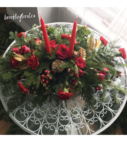 Red and Gold Centrepiece w/ Candles. An arrangement by Brooklin Floral and Garden Shoppe Inc..