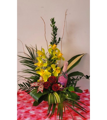 CUSTOM VALENTINE CHAMPENGE and ROSES BOUQUET. An arrangement by A Loving Touch Florist.