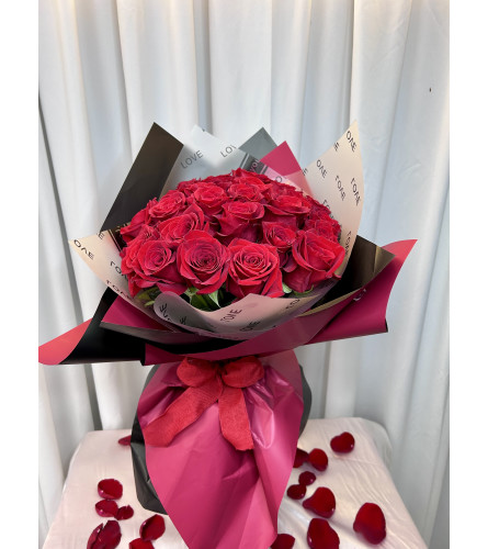 SIMPLY RED ROSES 24. An arrangement by M's Flowers.