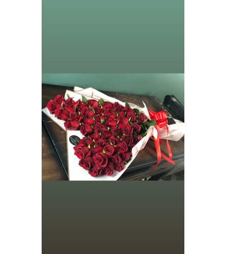 50 ROSES HEART SHAPE BOUQUET - Standard. An arrangement by BellaRosa Gardens.