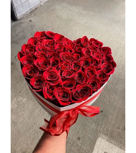24-30 ROSES IN HEART SHAPE BOX - Standard. An arrangement by BellaRosa Gardens.